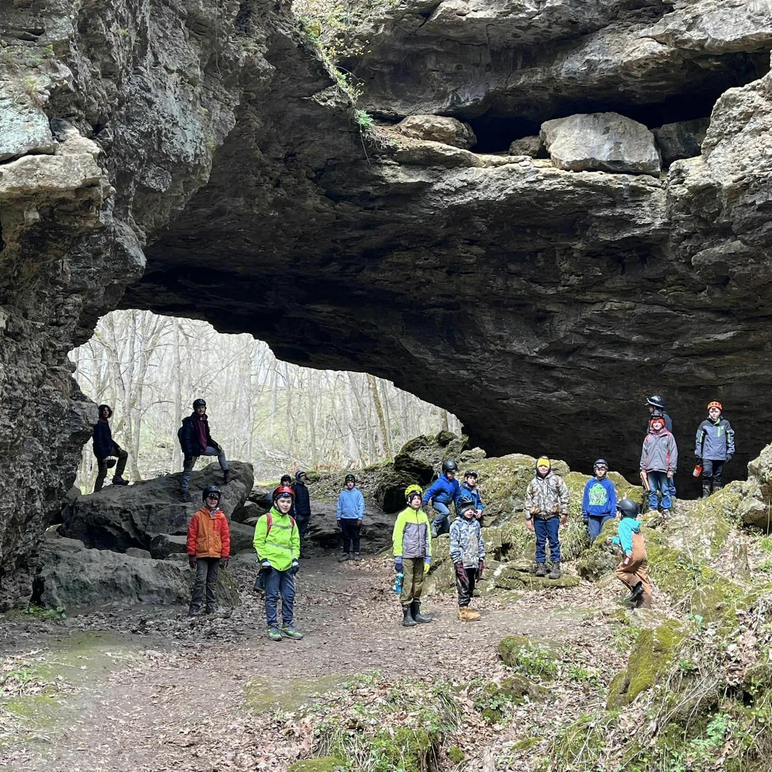 Scouts under rock